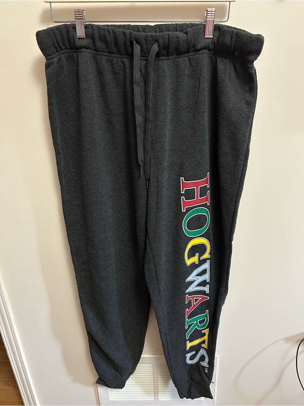 MAD Engine Black Joggers with Colorful Hogwarts Side Lettering